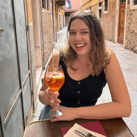Sara enjoying a drink in Europe
