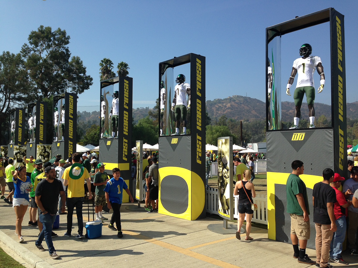 Football uniforms on display at the Mighty Oregon tailgate